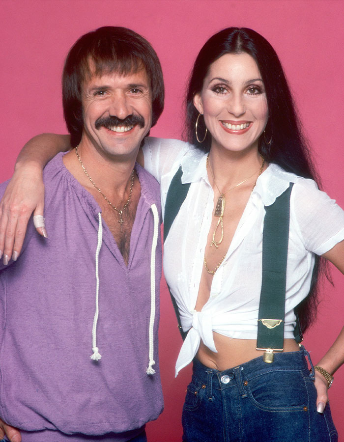 Cher and Sonny Bono smiling and posing together, representing raw and unfiltered confessions celebs shared in their memoirs