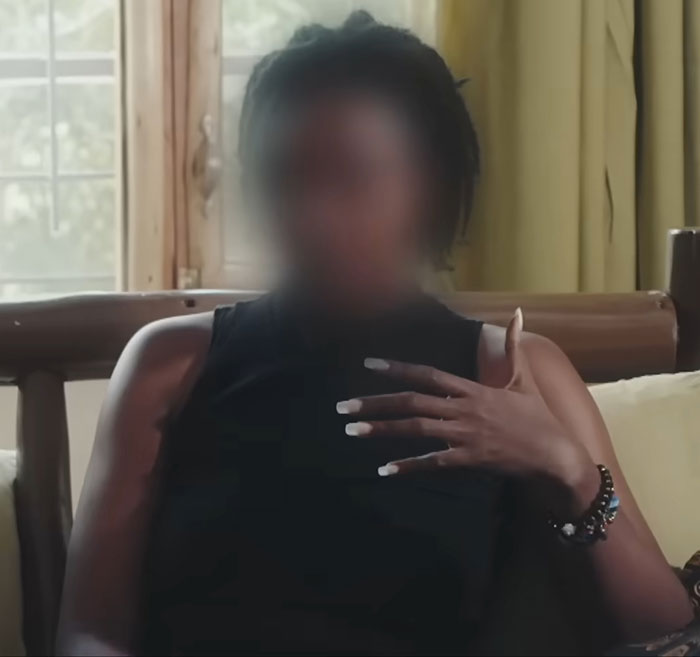 Young woman speaking out about the horror of Dubai's infamous porta potty parties in an indoor setting.