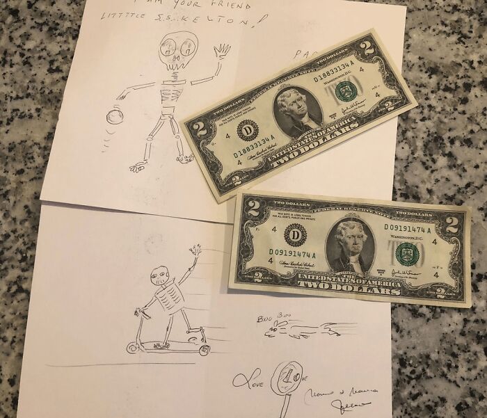 Hand-drawn skeleton sketches on paper with two two-dollar bills placed on a granite countertop, wholesome posts distraction.