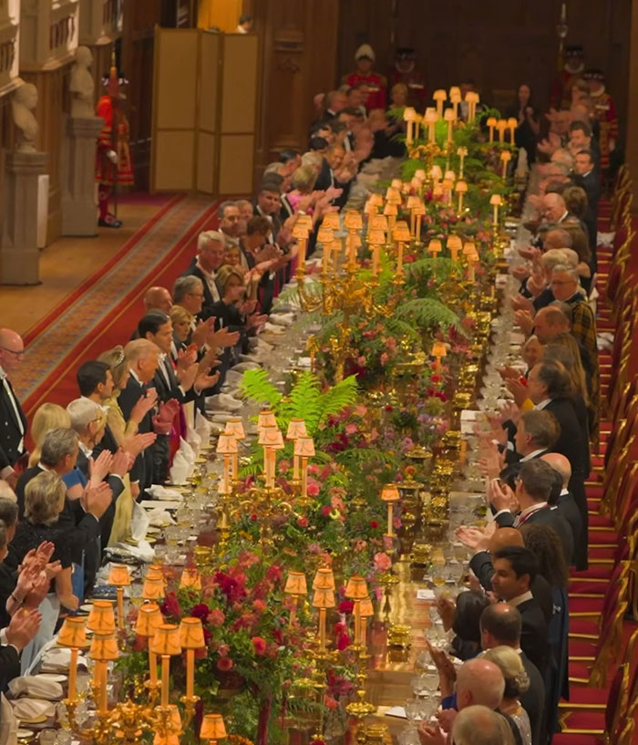 Elegant royal banquet with Queen Camilla and Kate Middleton, highlighting controversial gesture during Trump visit event.