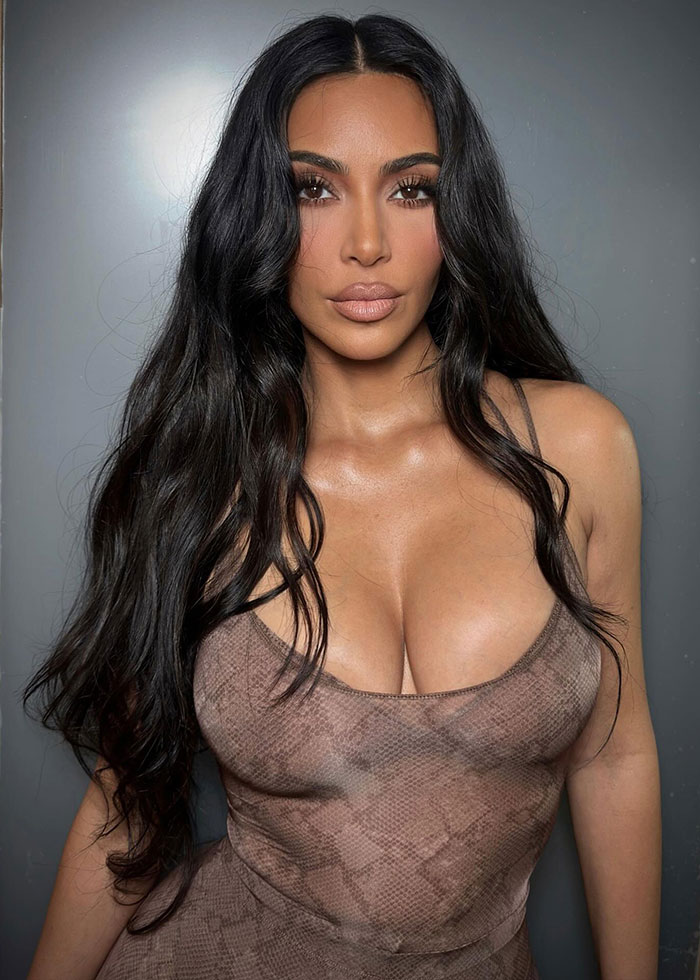 Woman with long dark hair wearing a snake-print top, representing Kanye West and daughter North public betrayal list reaction.