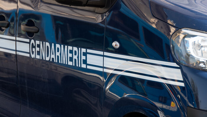 Close-up of a gendarmerie vehicle parked, related to passengers eating passports and causing mayhem during flight incident. Close-up of a gendarmerie vehicle parked, related to passengers eating passports and causing mayhem during flight incident.