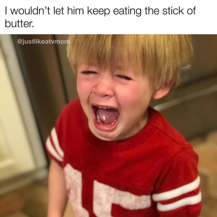 Crying child in a red shirt with a humorous parenting meme about eating a stick of butter back-to-school season.