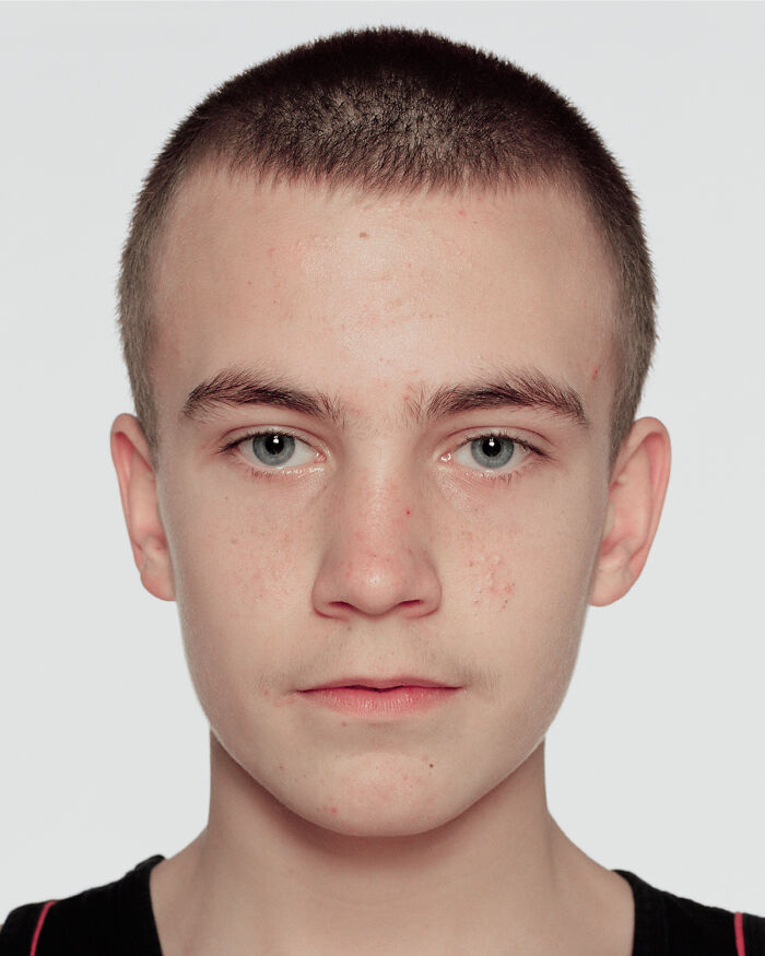 Close-up portrait of a young boxer before his first match showing determination and focus for powerful photographs.