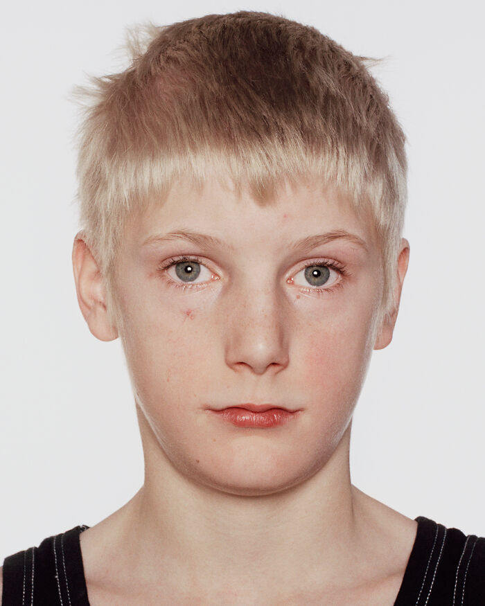 Young boxer with light hair and subtle facial bruises, captured powerfully before and after their first match.