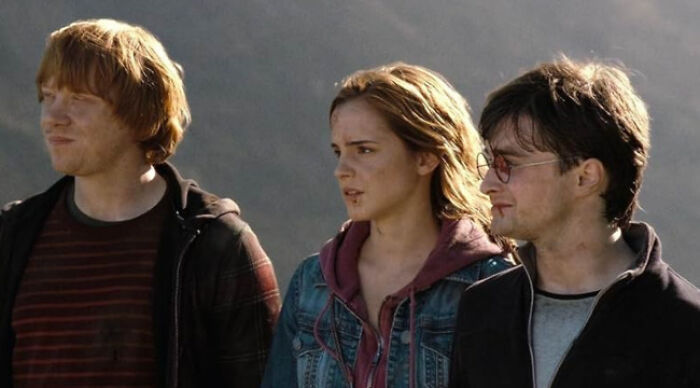 Three main Harry Potter characters standing outdoors, representing beloved movie tropes in a fan poll.