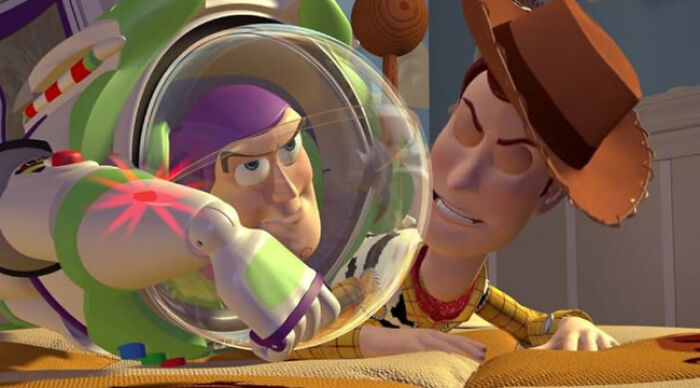 Animated scene depicting beloved movie tropes with iconic space ranger and cowboy characters in a playful confrontation.