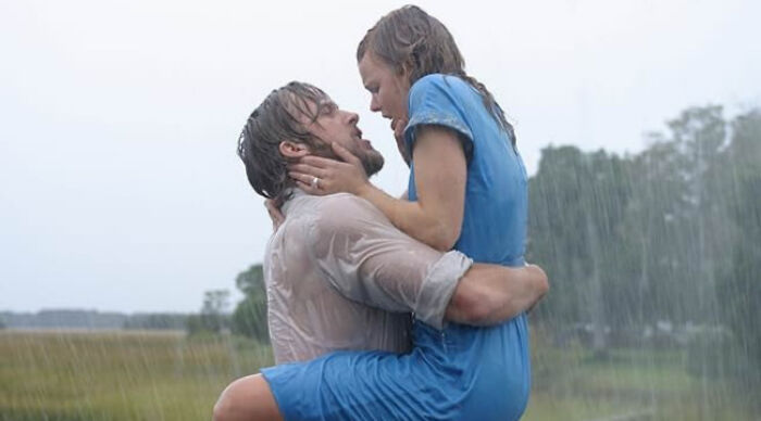 Couple embracing in the rain, illustrating a beloved movie trope from the ultimate movie tropes poll image.