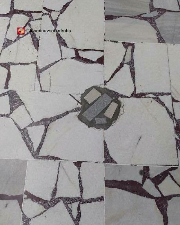 Floor tiles with irregular, mismatched construction and uneven design creating a chaotic and poorly planned appearance.