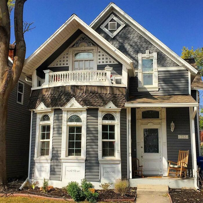 Charming old home with detailed trim and a small porch, showcasing classic architectural features and cozy curb appeal.