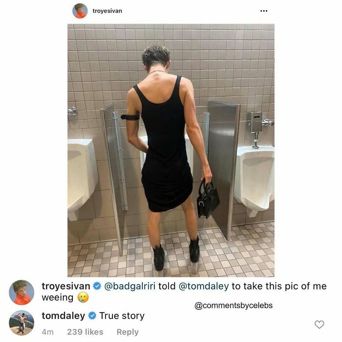 Celebrity dropping unexpected gems in comments with a casual photo in a restroom holding a small bag, dressed in black.