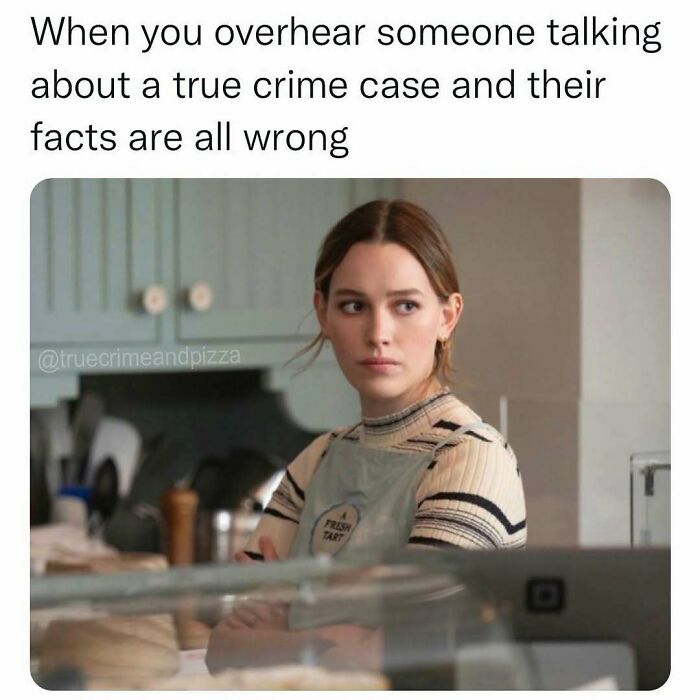 Woman in a kitchen looking annoyed while overhearing wrong facts about a true crime case, reflecting true crime memes.