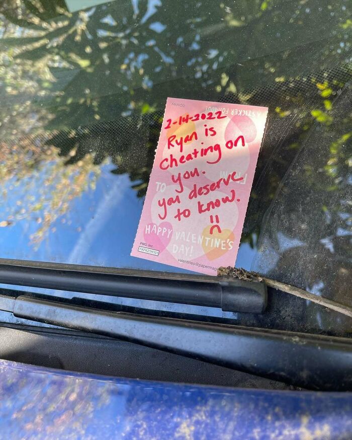 Note on a car windshield accusing a neighbor of cheating, illustrating unbearable neighbor conflicts.