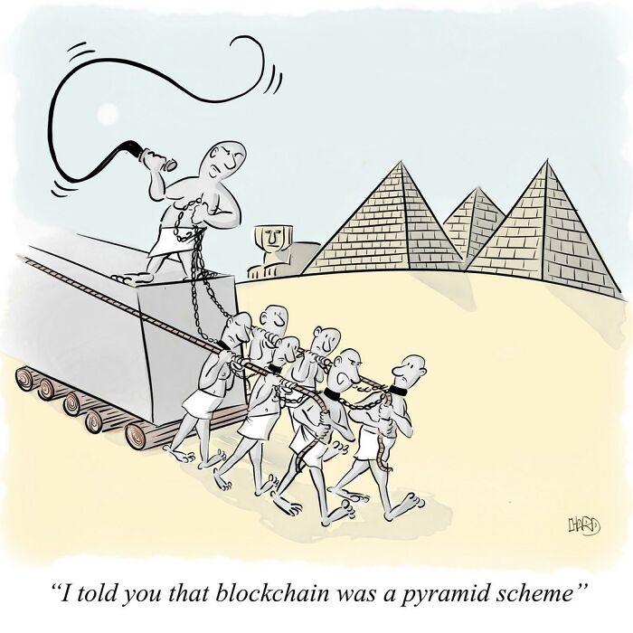 Funny one-panel comic showing chained workers pulling a giant pyramid with ancient pyramids in the background.