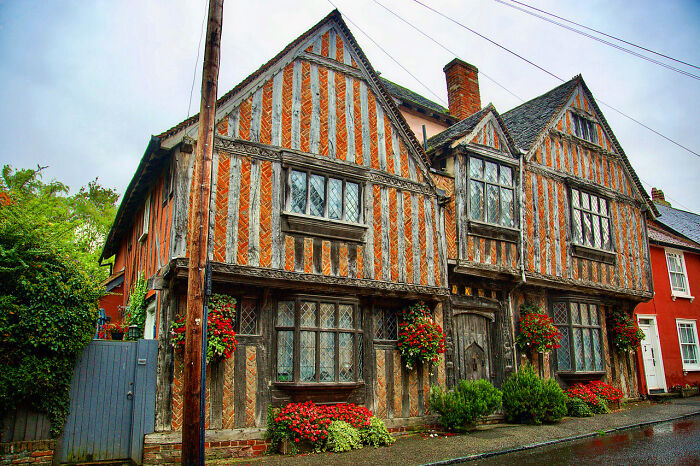 Tudor-style iconic TV house with timber framing and flower boxes, one of the real-life TV houses you probably didn’t know exist.