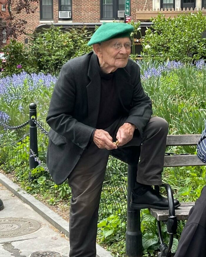 Elderly man wearing a green beret and stylish dark blazer, showcasing cool and stylish grandparents fashion outdoors.