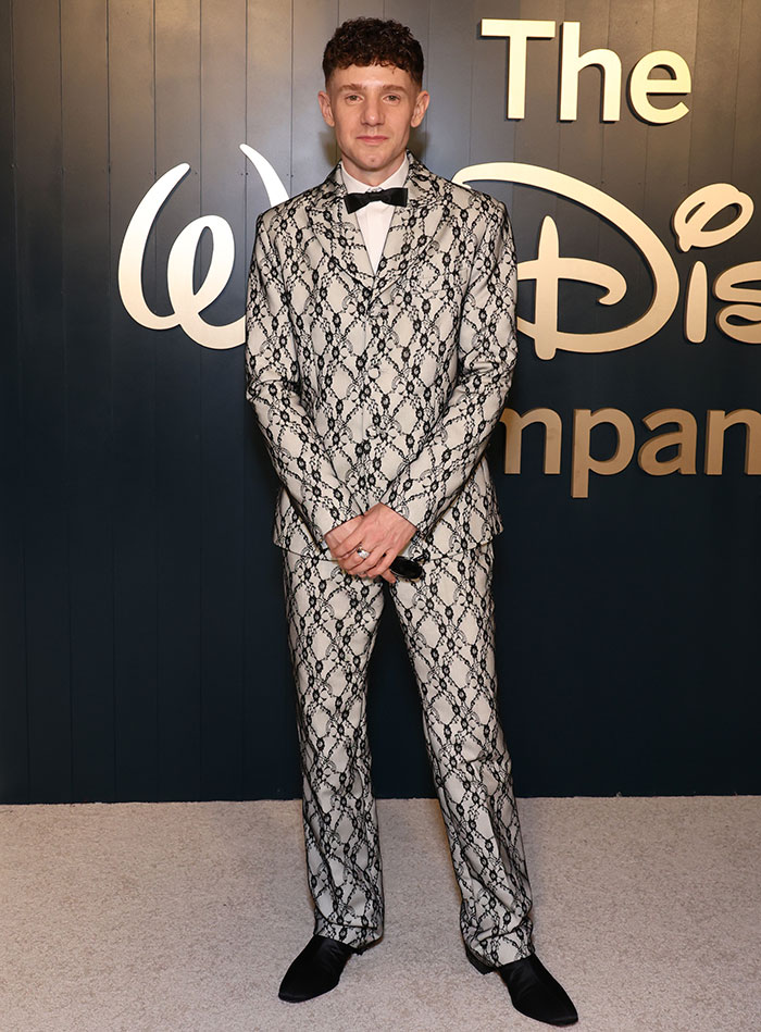 Celebrity wearing a patterned suit and bow tie at the 2025 Emmys after parties, showcasing standout celebrity outfits.