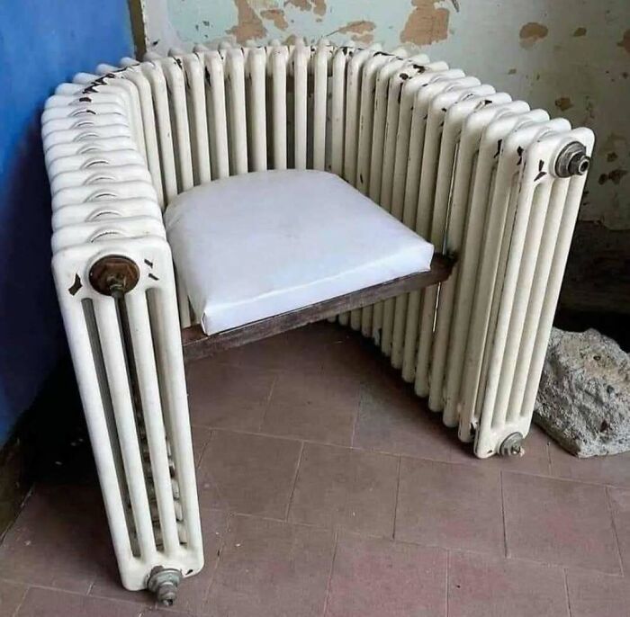 Chair made from old radiator pipes with a cushion seat, showcasing unique and quirky construction and designs.