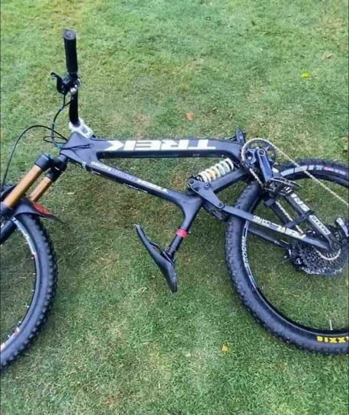 Mountain bike with a bizarre construction design featuring a misplaced seat and frame, showcasing unusual construction and designs.