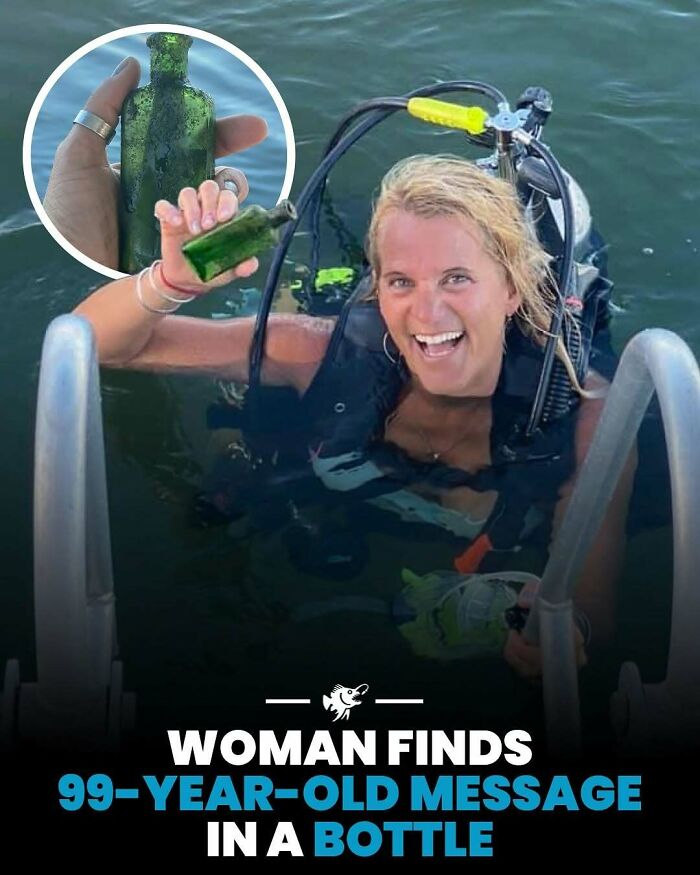 Smiling scuba diver holds a 99-year-old message in a bottle found underwater, showcasing fascinating deep sea images and facts.