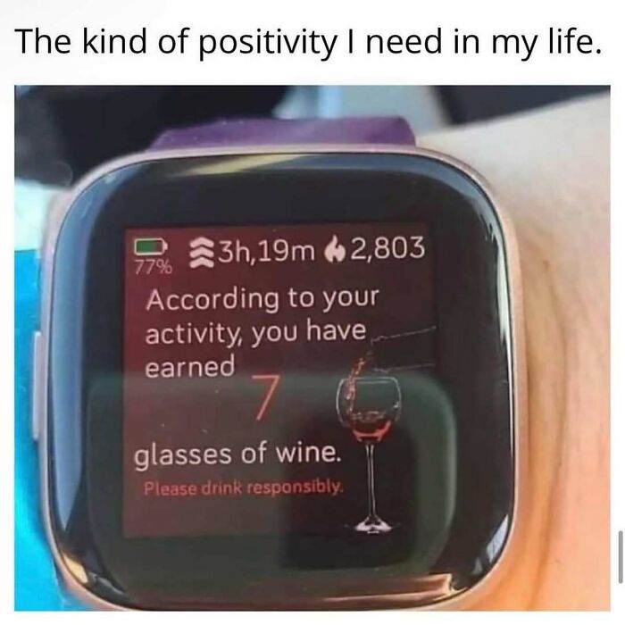 Smartwatch screen showing 7 glasses of wine earned from activity, illustrating relatable funny meme about positivity and balance.