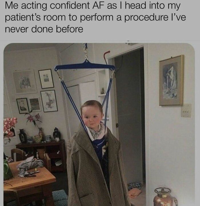 Baby in oversized coat hanging from a baby jumper, humorously illustrating the struggle and humor of working in medicine.