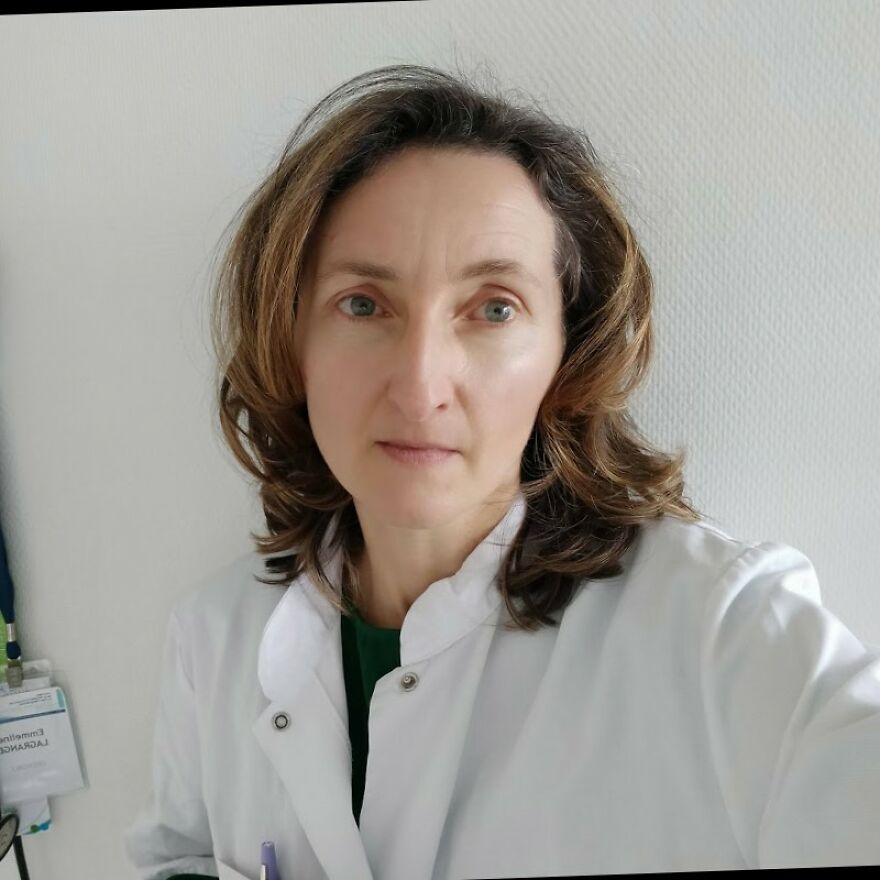 Female scientist in a white lab coat researching the link between wealthy-favored superfood and ALS disease risks.