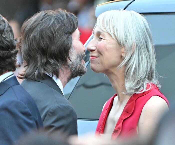 Keanu Reeves' girlfriend in a candid moment, breaking her silence on marriage rumors at a public event.