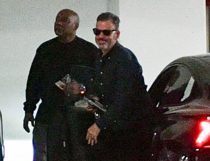 Jimmy Kimmel smiling and wearing sunglasses while standing next to a man near a car, related to staff mutiny news. Jimmy Kimmel smiling and wearing sunglasses while standing next to a man near a car, related to staff mutiny news.