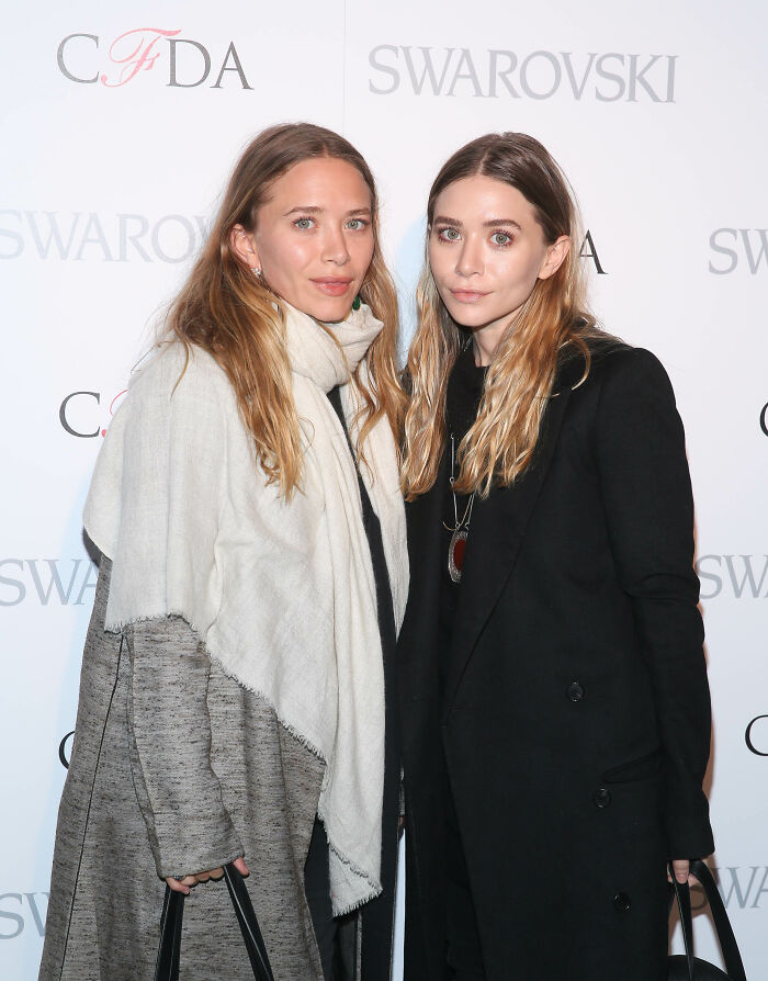 Mary-Kate and Ashley Olsen at a fashion event, showcasing striking and unrecognizable looks at New York Fashion Week. Mary-Kate and Ashley Olsen at a fashion event, showcasing striking and unrecognizable looks at New York Fashion Week.