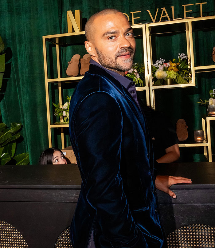 Man in a dark velvet blazer posing indoors, showcasing celebrity outfit style that caught attention at Emmys after parties 2025