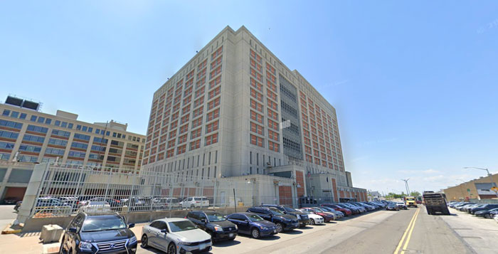 Large urban building with parked cars outside, related to America&rsquo;s Next Top Model Luigi Mangione Shein ad controversy.