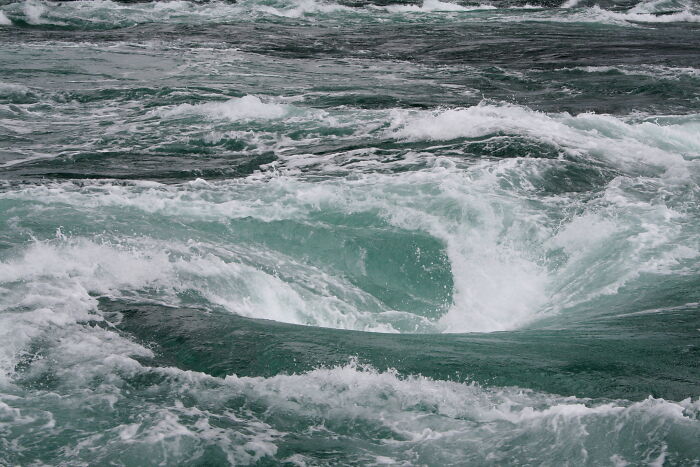 Powerful ocean whirlpool with turbulent waves showing a real life scene more interesting and bizarre than fiction