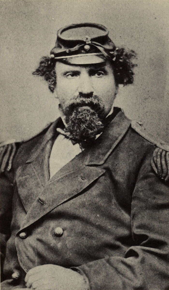 Vintage portrait of a bearded man in military uniform, showcasing a real life moment more interesting and bizarre than fiction