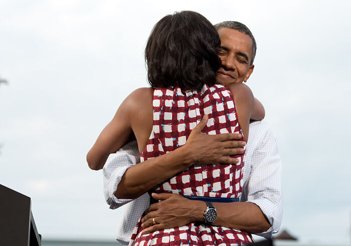 Barack Obama hugging Michelle Obama, showing a moment of closeness as they navigate life after the presidency. Barack Obama hugging Michelle Obama, showing a moment of closeness as they navigate life after the presidency.