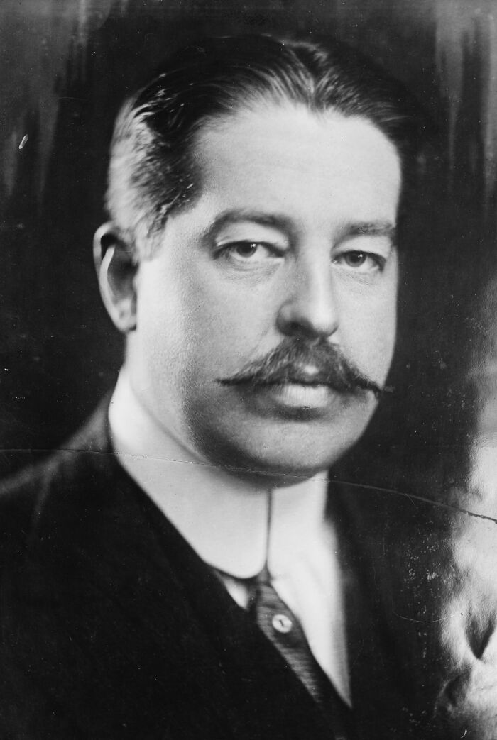 Black and white portrait of a man with mustache representing the world’s richest family losing wealth over generations.