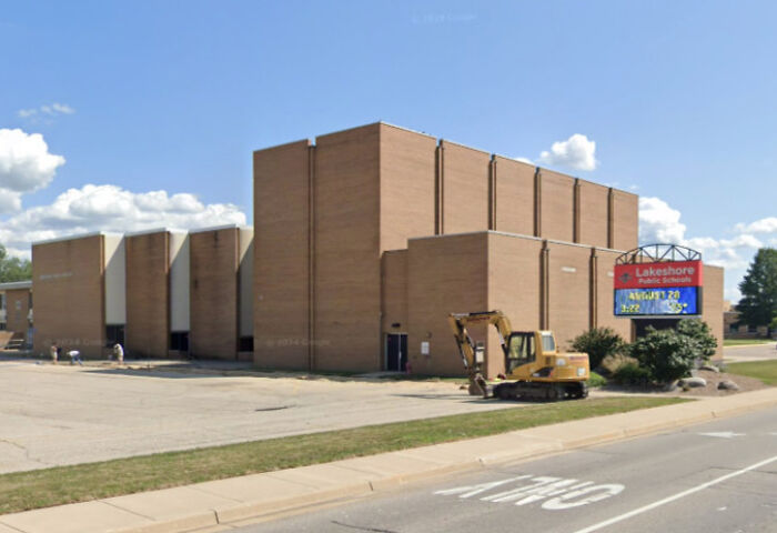 Lakeshore Public Schools building exterior with digital sign on sunny day reflecting school&rsquo;s strong and decisive action policy.