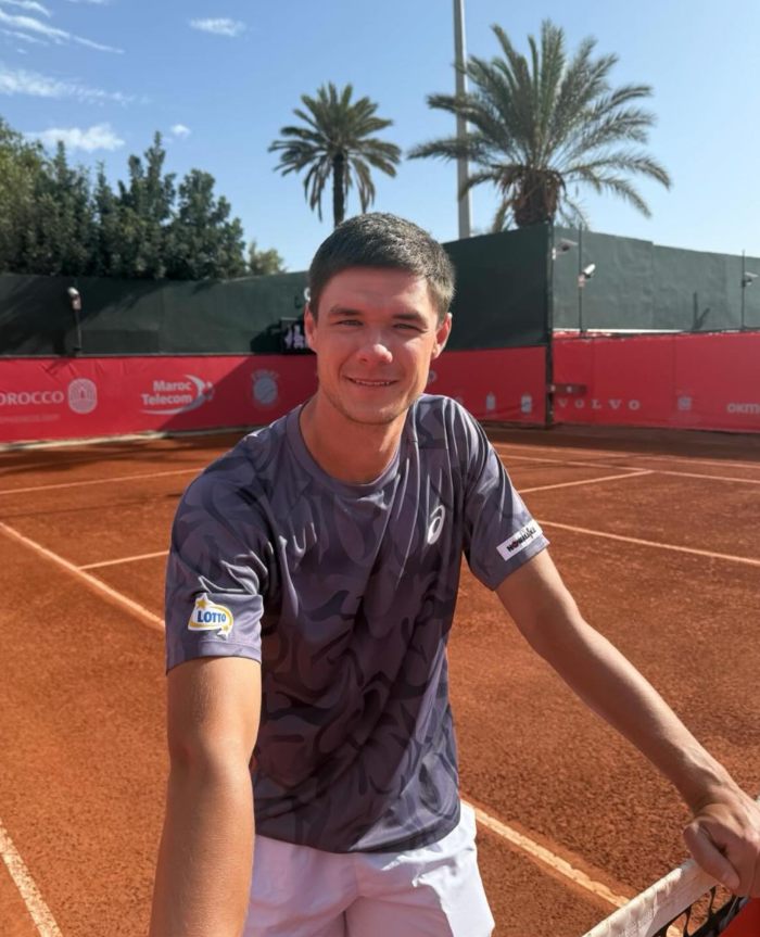 Young man on tennis court under clear sky, linked to disgraced CEO who snatched boy's cap at US Open viral incident. Young man on tennis court under clear sky, linked to disgraced CEO who snatched boy's cap at US Open viral incident.