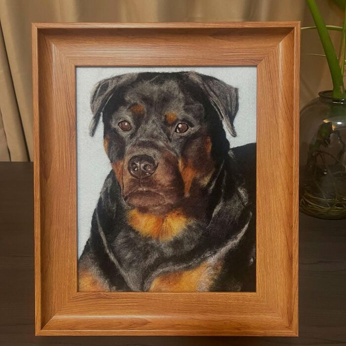 Framed wool felt pet portrait of a realistic Rottweiler dog with detailed fur and expressive eyes on a white background.