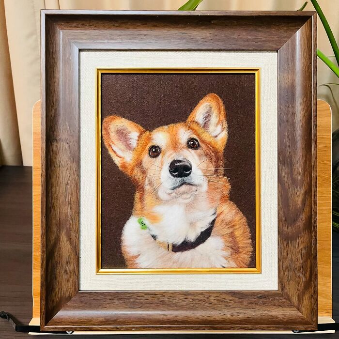 Framed wool felt pet portrait of a realistic corgi dog with detailed fur and lifelike expression.