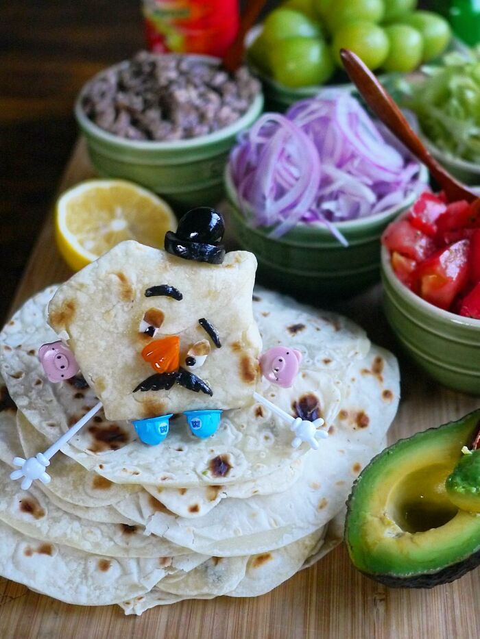 Creative meal by a mom from Japan featuring a character made with flatbread and colorful edible decorations for kids.