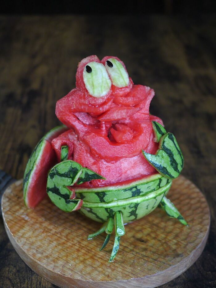 Watermelon carved into a creative crab shape, showcasing artistic meals by a mom from Japan for her kids.