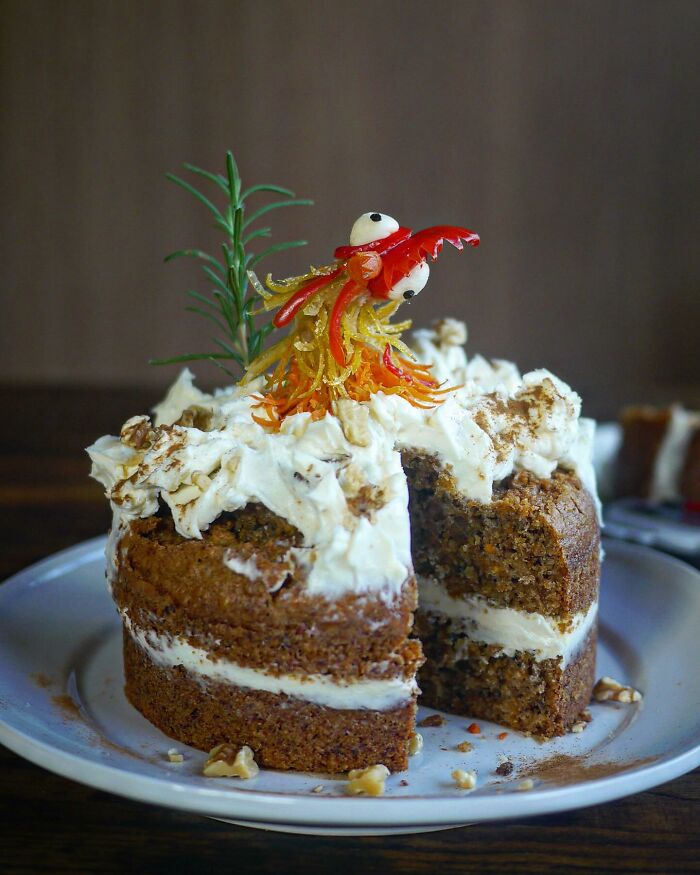 Incredibly creative meals by a mom from Japan featuring a decorated cake with whipped cream and a playful edible figure on top.