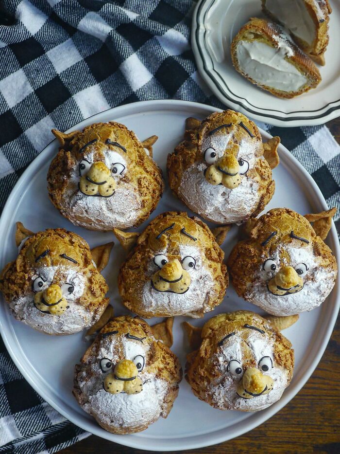 Creative meals from a mom in Japan featuring detailed animal-shaped cream-filled pastries on a plate with a checkered cloth.