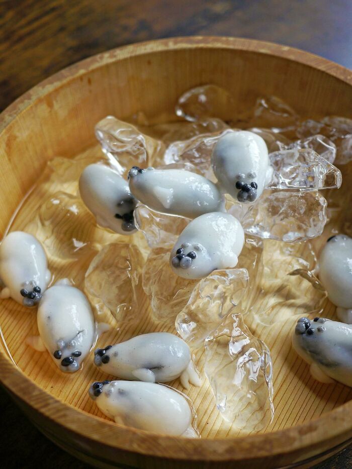 Creative meals for kids featuring adorable seal-shaped desserts on ice in a wooden bowl, showcasing inventive food art from Japan.