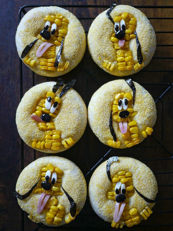 Creative meals for kids featuring corn and seaweed dog faces on round bread rolls by a mom from Japan.