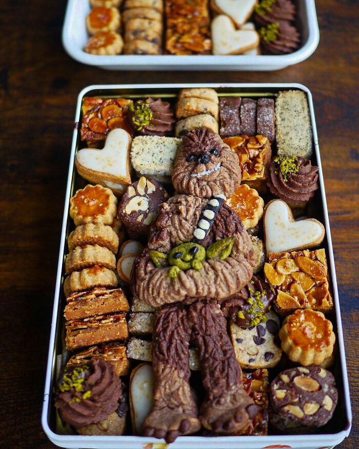 Creative homemade cookies shaped like characters, showcasing unique and artistic meals by a mom from Japan for her kids.