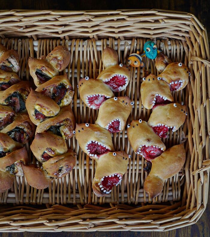 Creative meals for kids featuring playful shark-shaped and fish-themed baked goods arranged in a wicker basket.