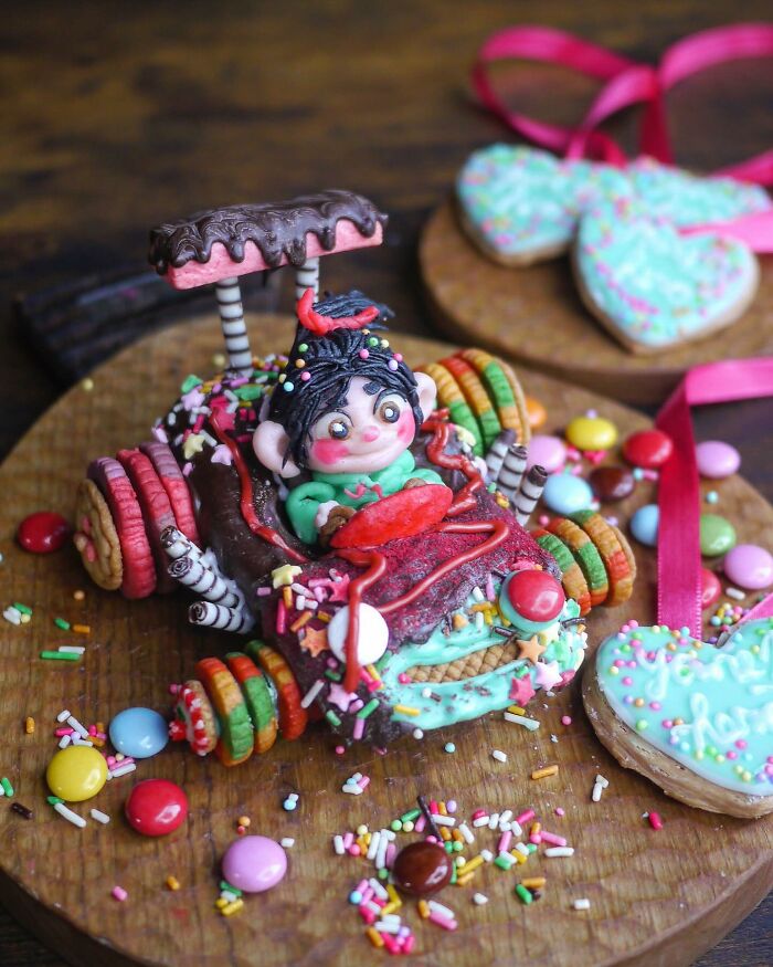 Intricately decorated creative meal shaped like a colorful candy car with a cute character driving, made by a Japanese mom.