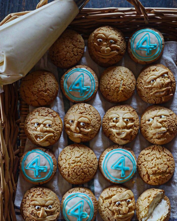 Basket of creatively decorated cookies with faces and blue number 4 icing, showcasing inventive meals by a mom from Japan.